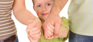 5-6 years old boy with his parents isolated on white